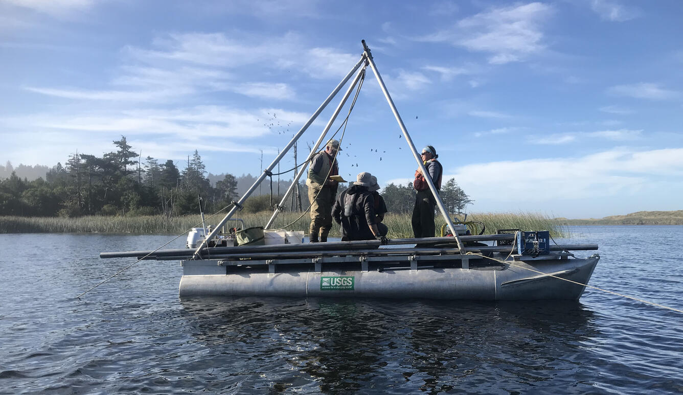 Four people on a boat with a metal frame.