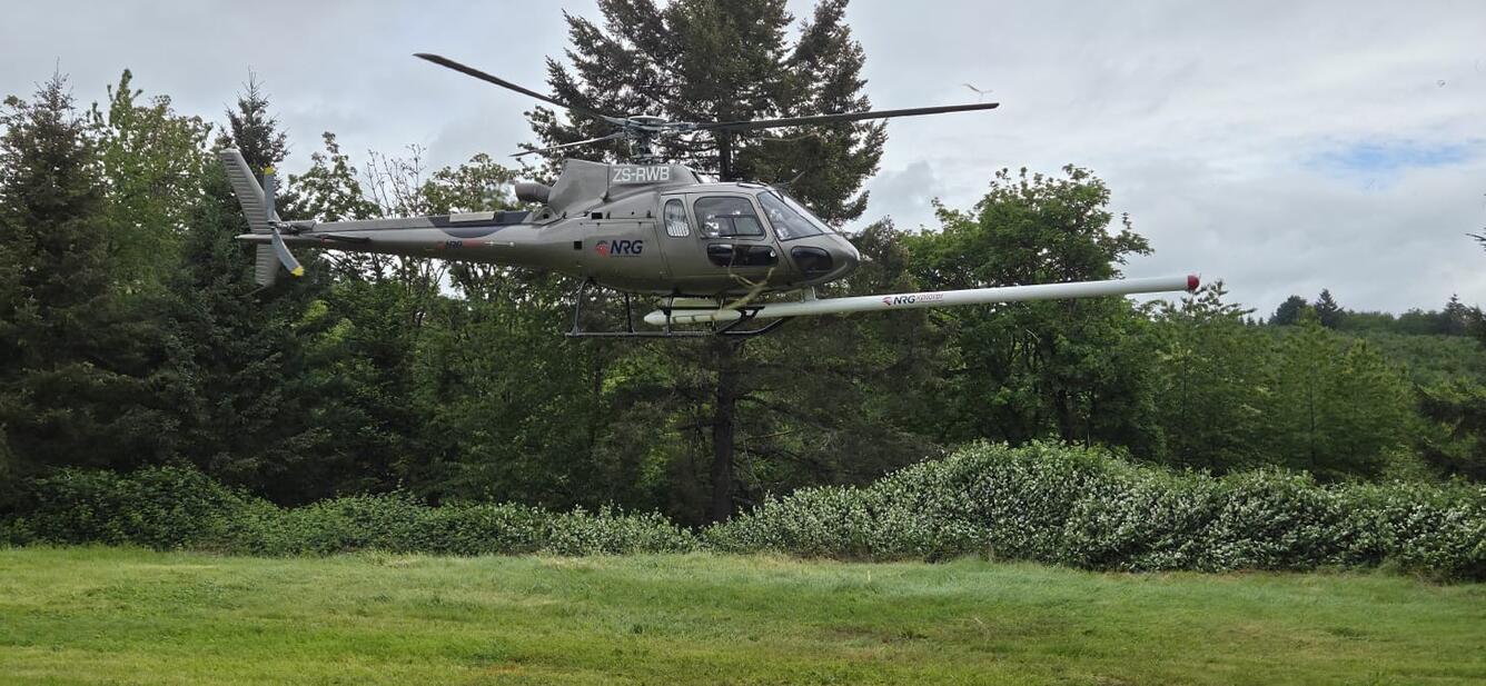 gray helicopter with the “stinger” extending forward
