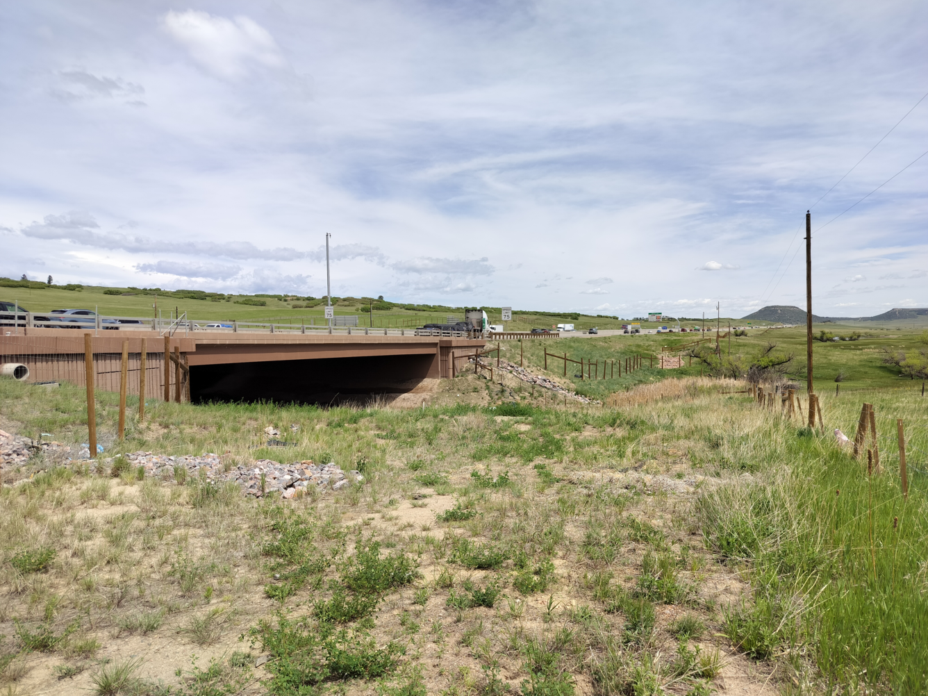 View of a highway underpass, cars driving above