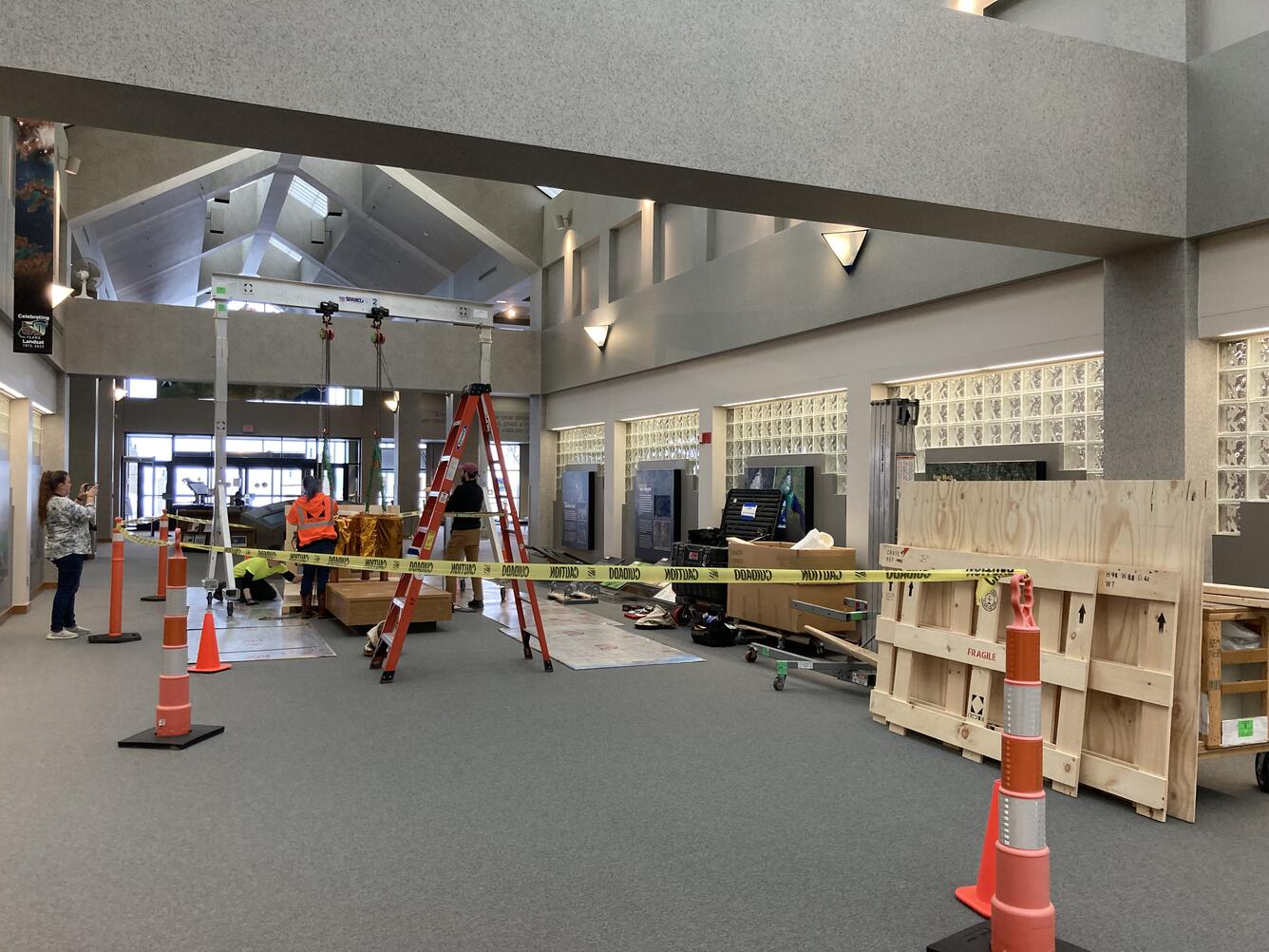 A lobby strewn with equipment and packing materials