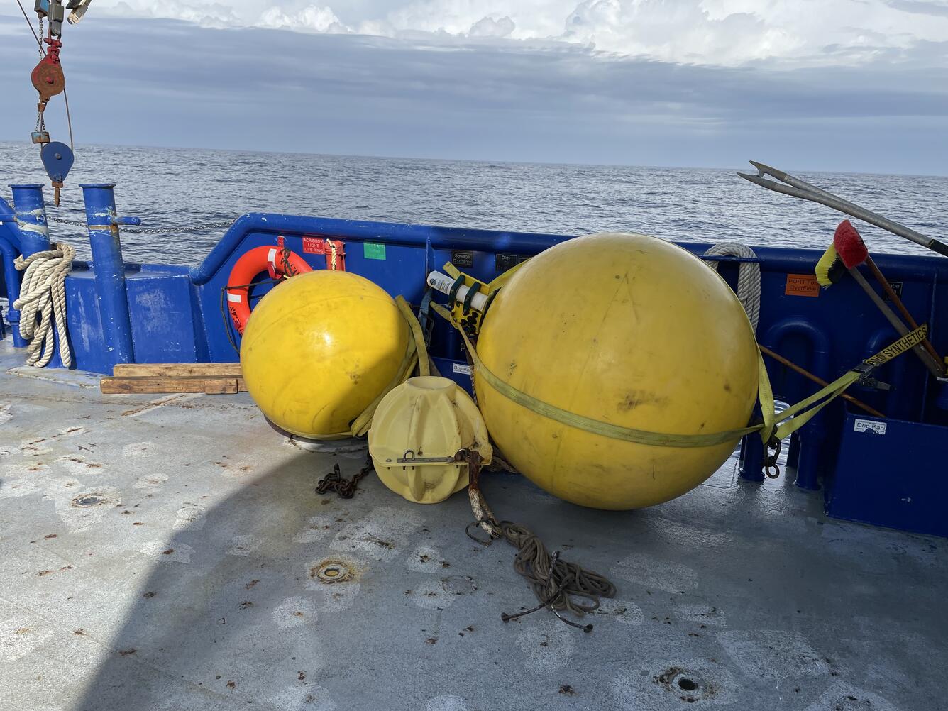 three buoys secured to boat deck