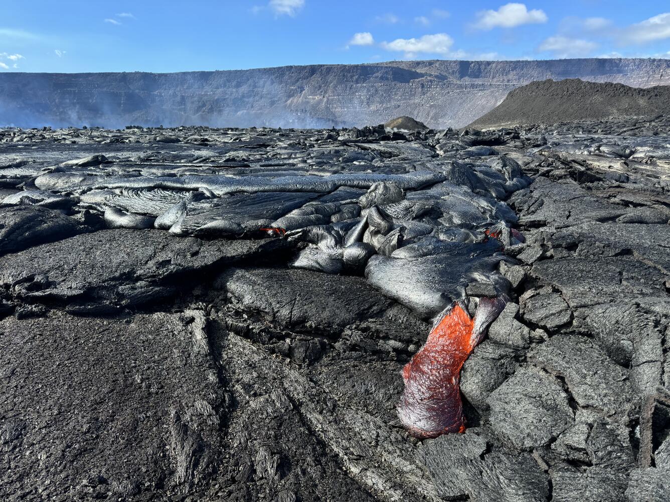 Color photograph of active lava flowing