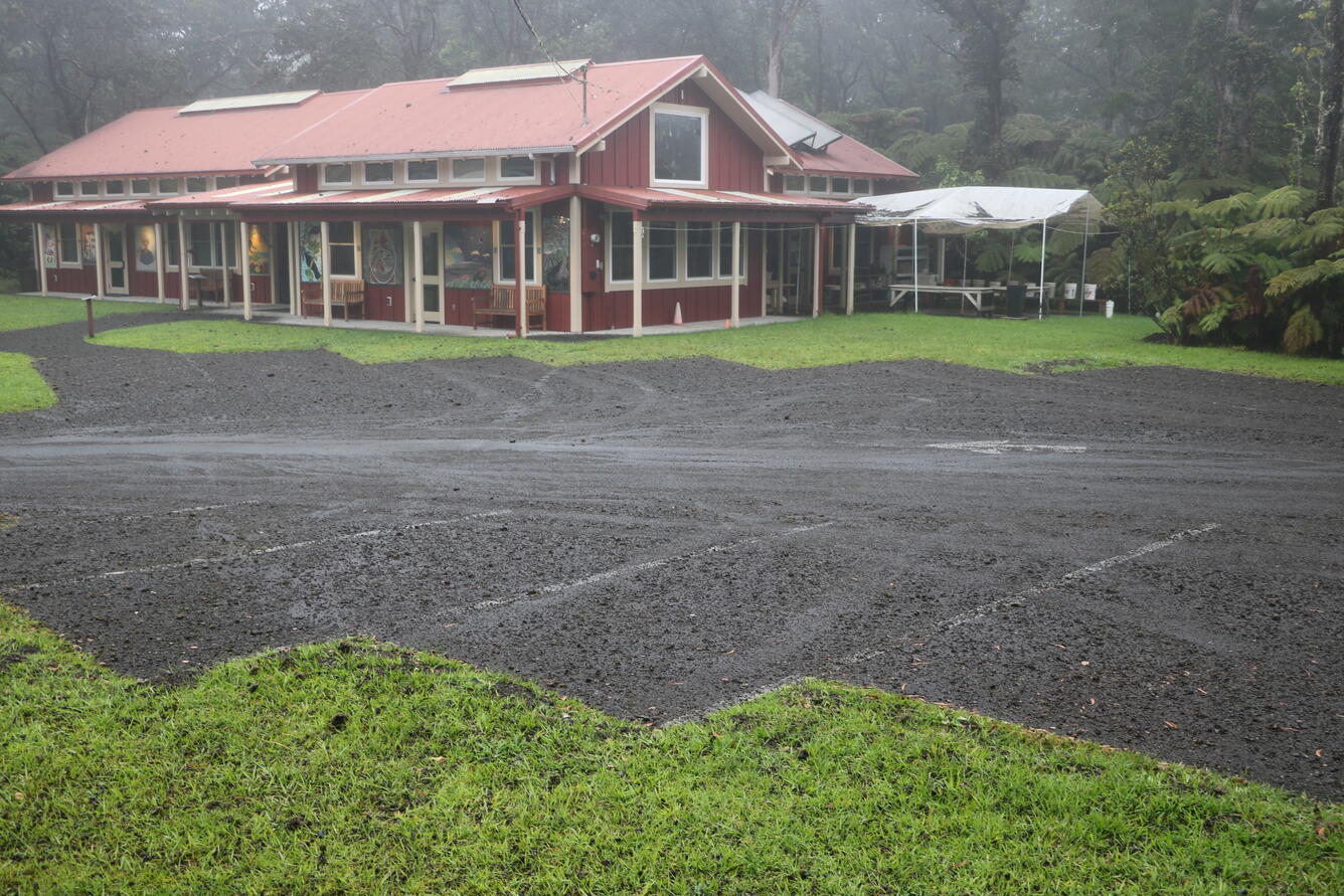 Color photograph of parking lot with volcanic deposits