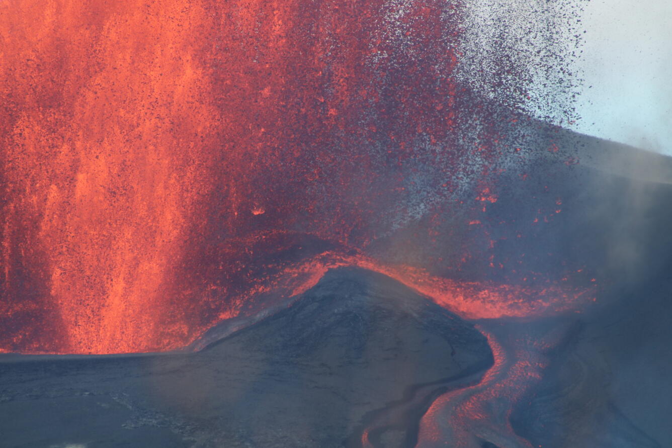 Color photograph of lava fountain and channelized lava flow