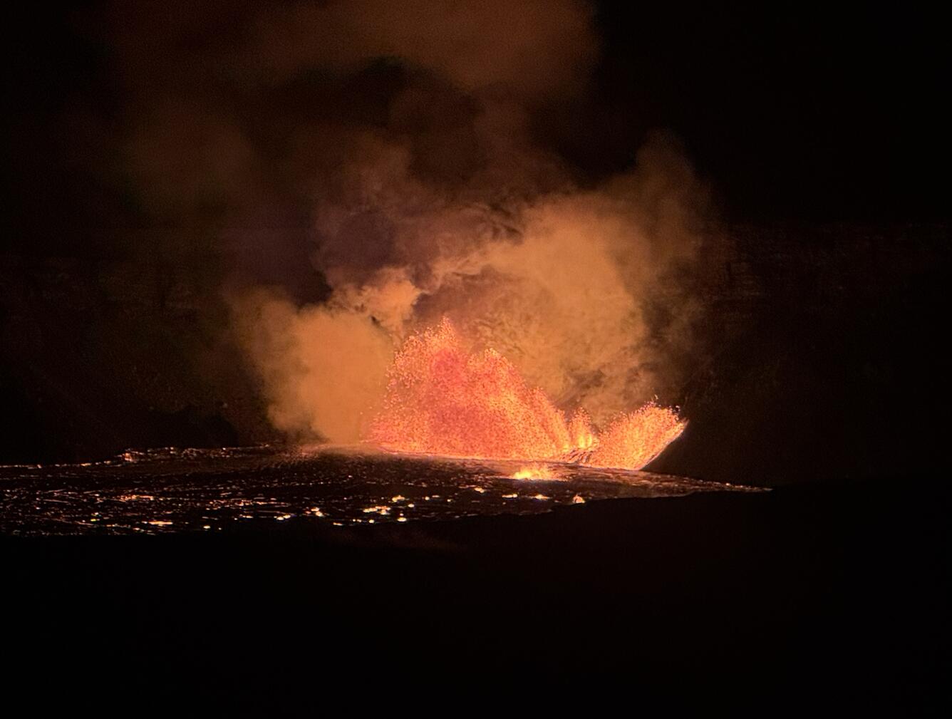 Color photograph of vents erupting lava
