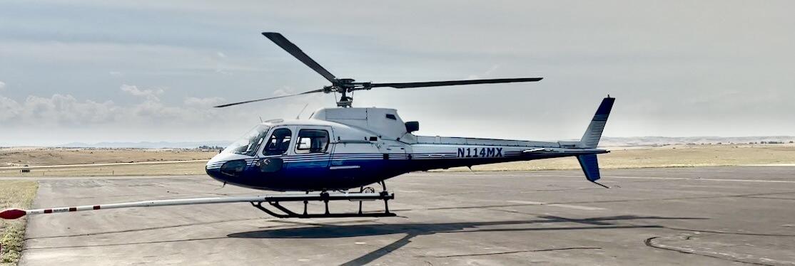 blue and white helicopter (N114MX) that will be used for the Earth MRI survey over eastern Oregon