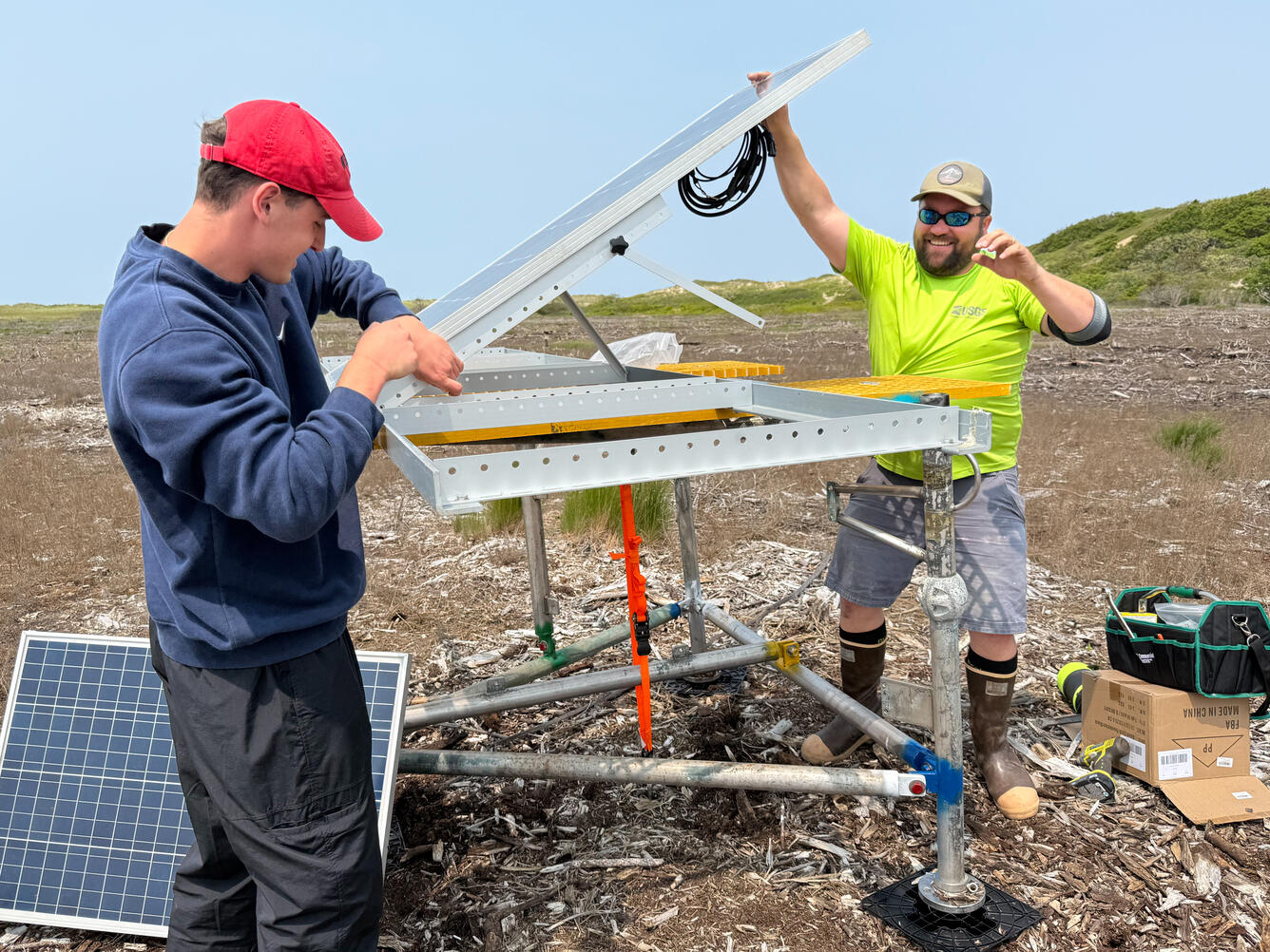 Two scientists working in a coastal wetland