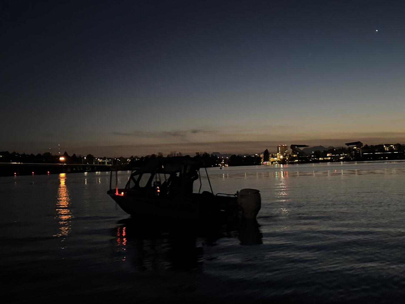 fieldwork boat on the water at dusk