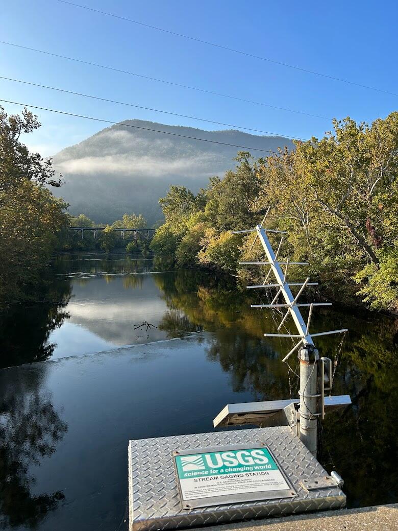 Monitoring box and antenna, with the Shenandoah river and the blue ridge mountains in the background.