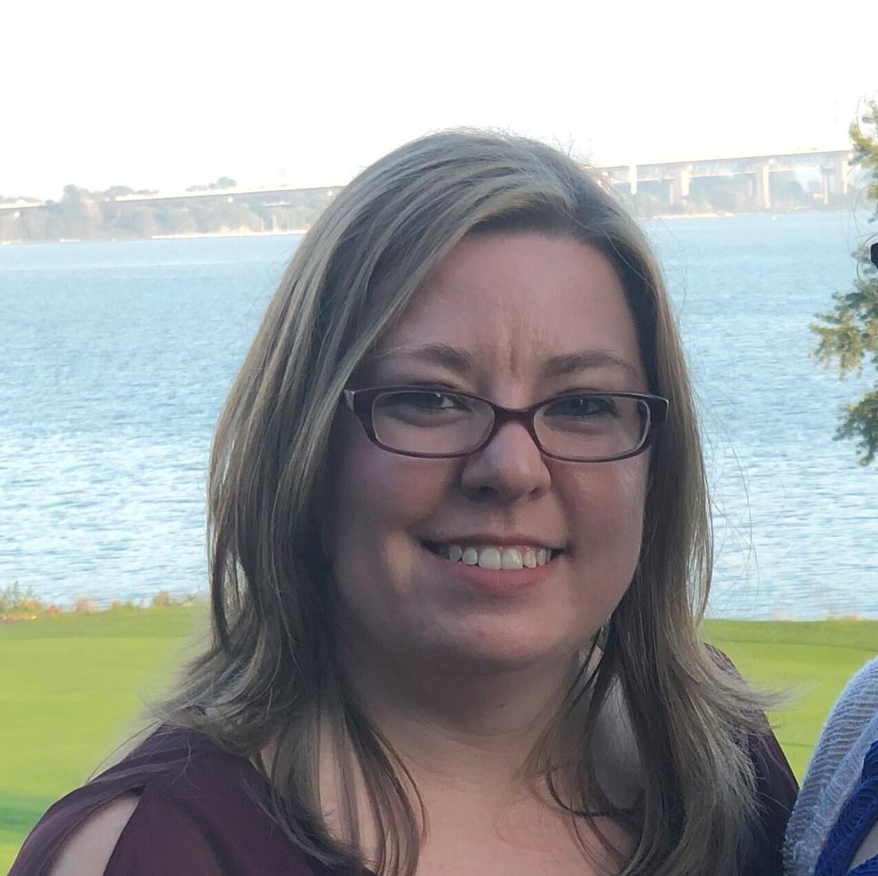 Picture of Diana Carriker. A lake is in the background