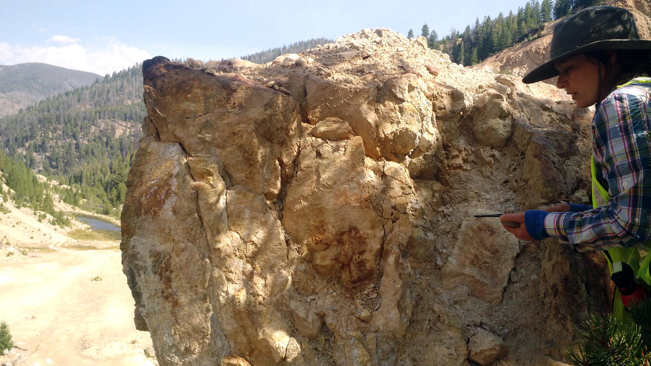 Geologist conducting field work within the Yellow Pine/Stibnite gold-antimony-tungsten mining area in central Idaho