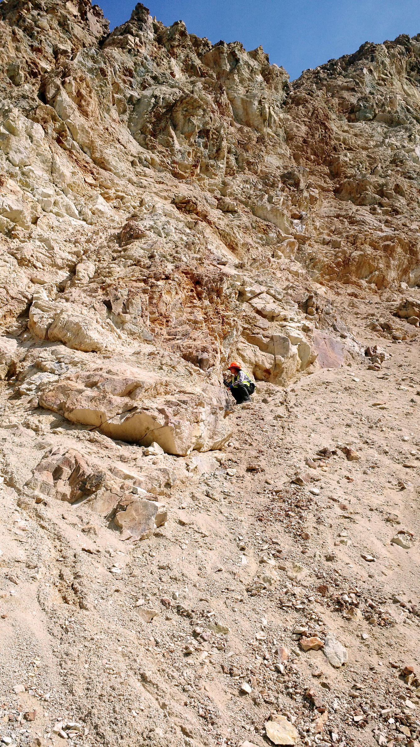 Geologist conducting field work at the gold-antimony-tungsten mining area