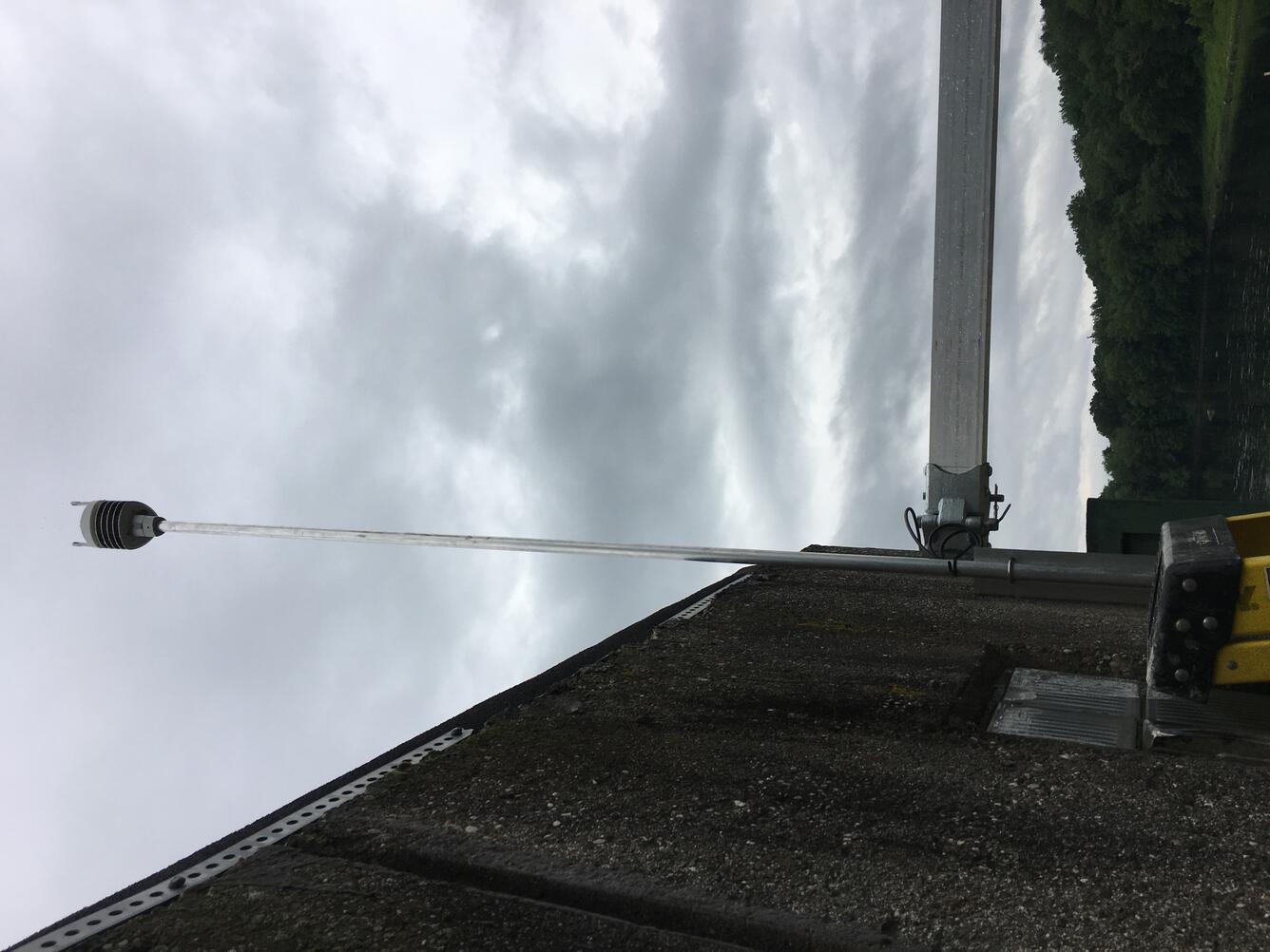 Looking up at the weather sensor attached to the side of the gage house