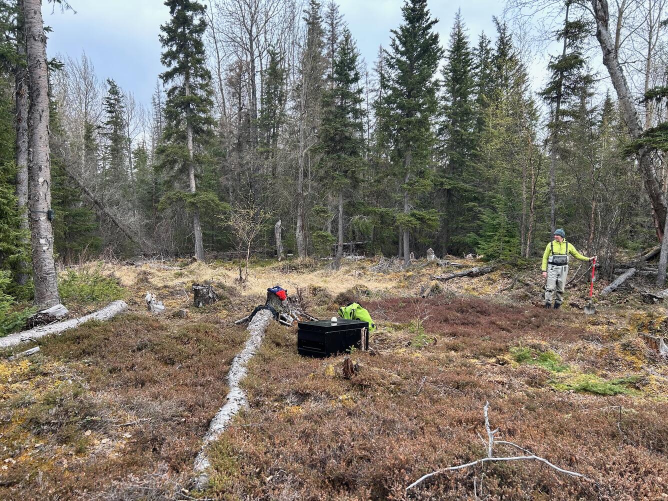 person in green shirt marks location of sensor