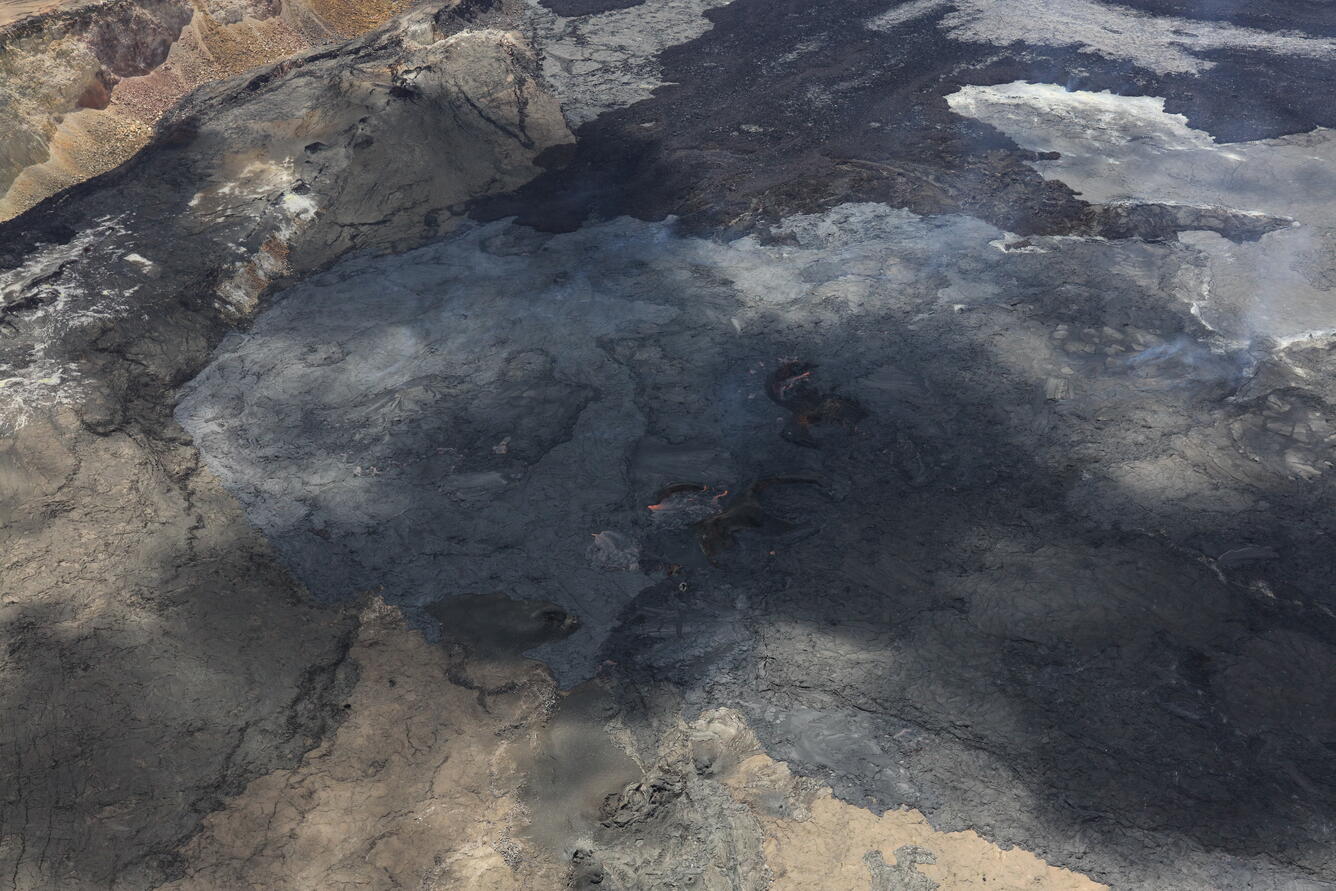 Color photograph of active lava flows on caldera floor