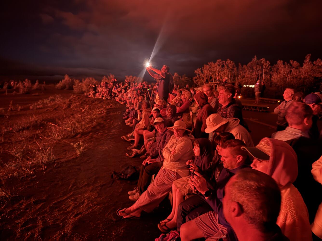 Color photograph of eruption viewers at night