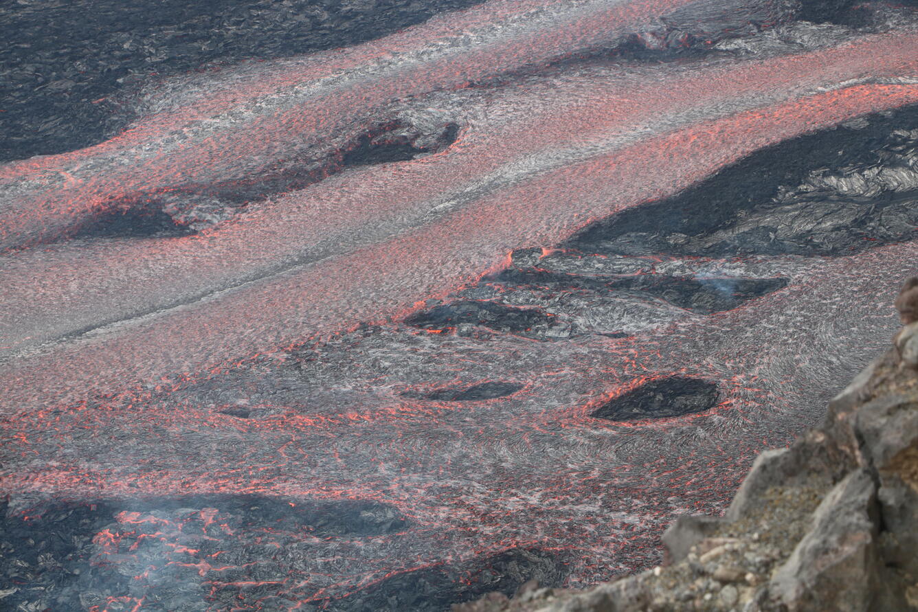 Color photograph of lava channels flowing during eruption