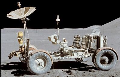The lunar roving vehicle on the Moon: a bare-bones open cart-type vehicle with several instruments resting on the gray Moon
