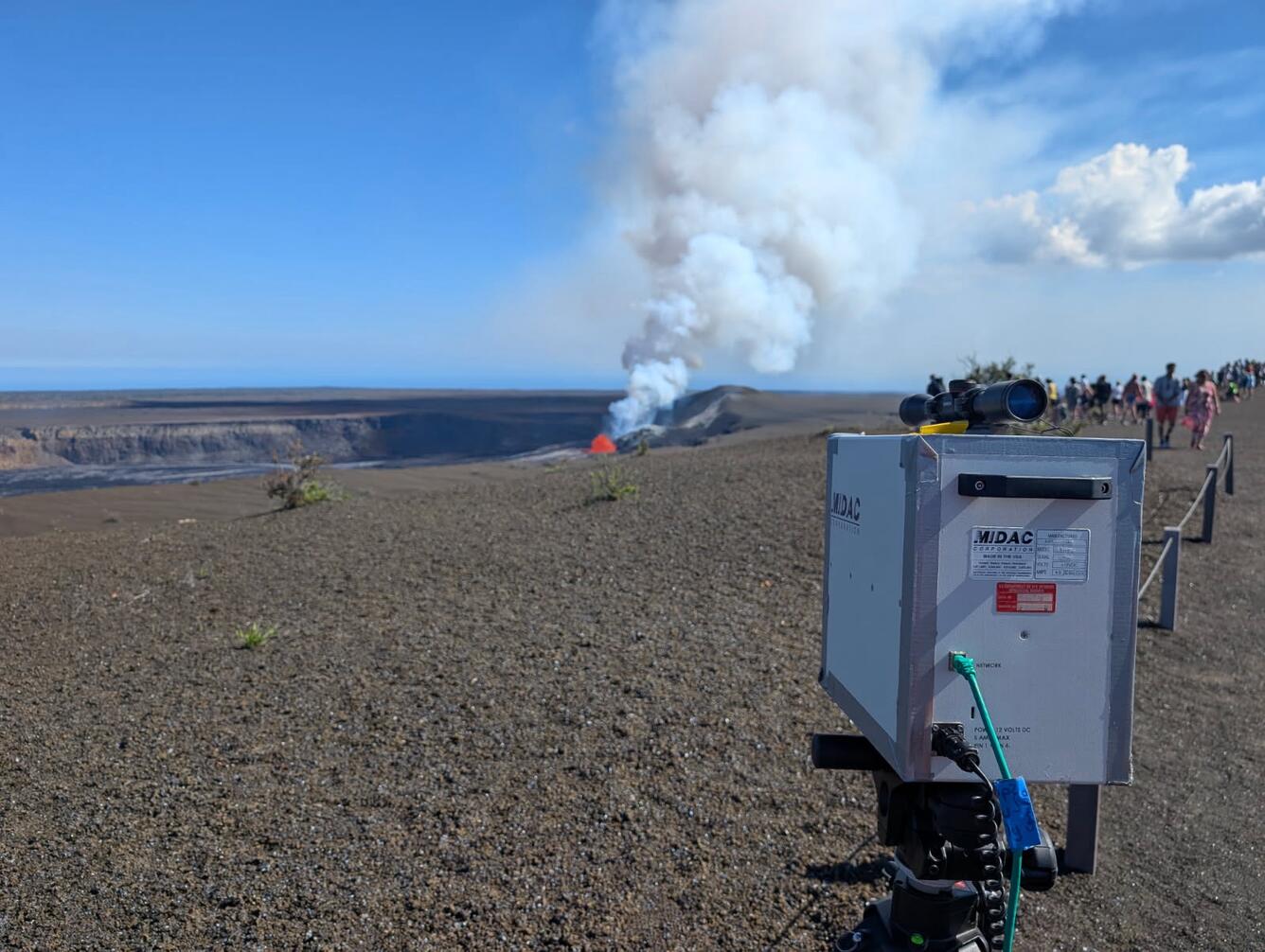 Volcano monitoring instrument pointed at a small lava fountain in crater