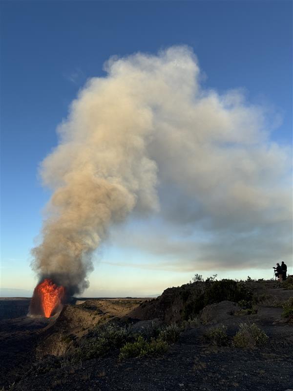 Color photograph of lava fountain and eruption plume