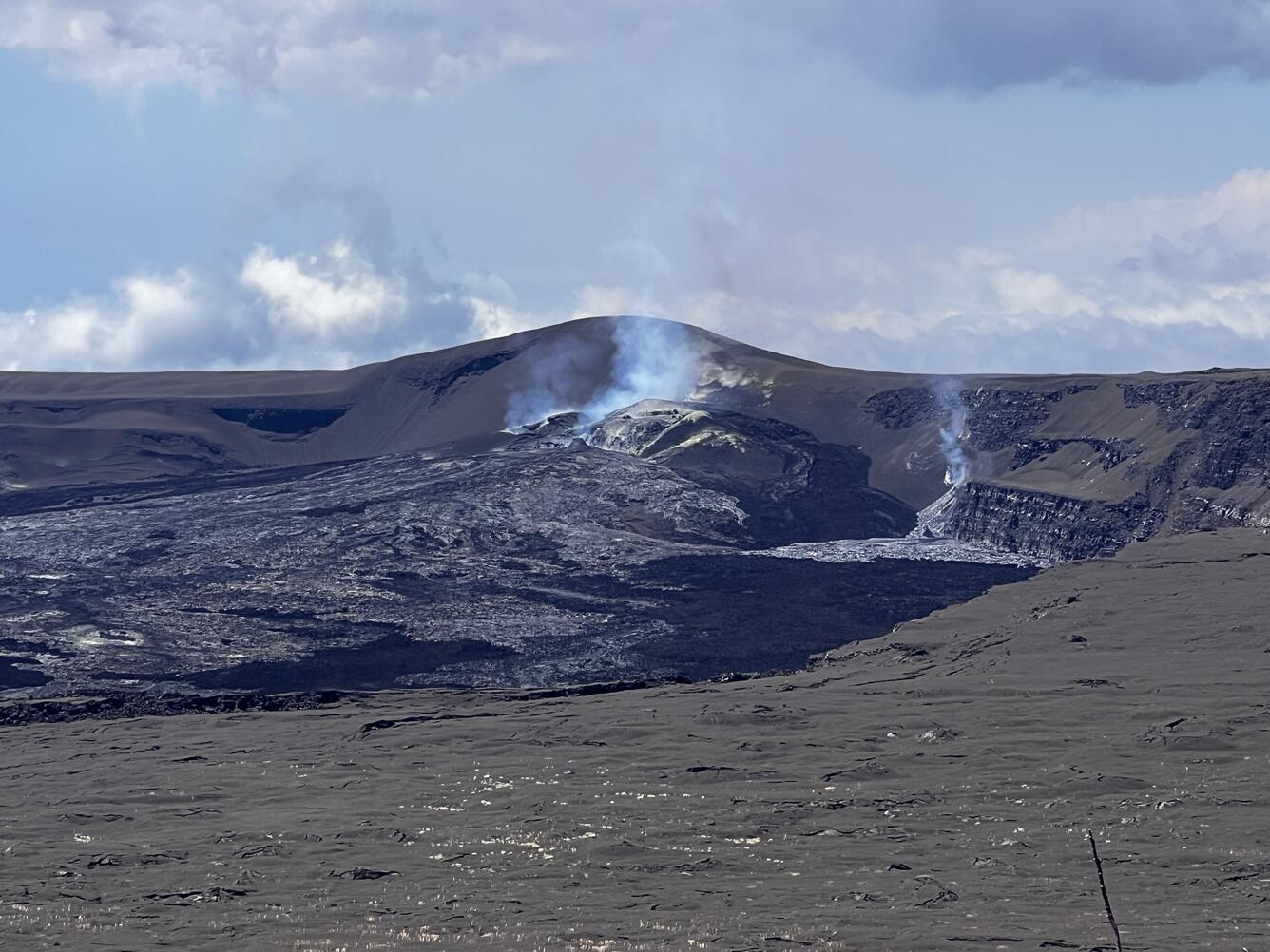 Color photograph of volcanic vents degassing