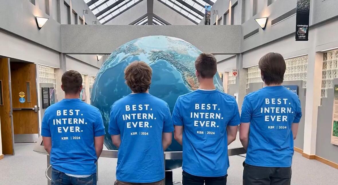 Interns show off their t-shirts