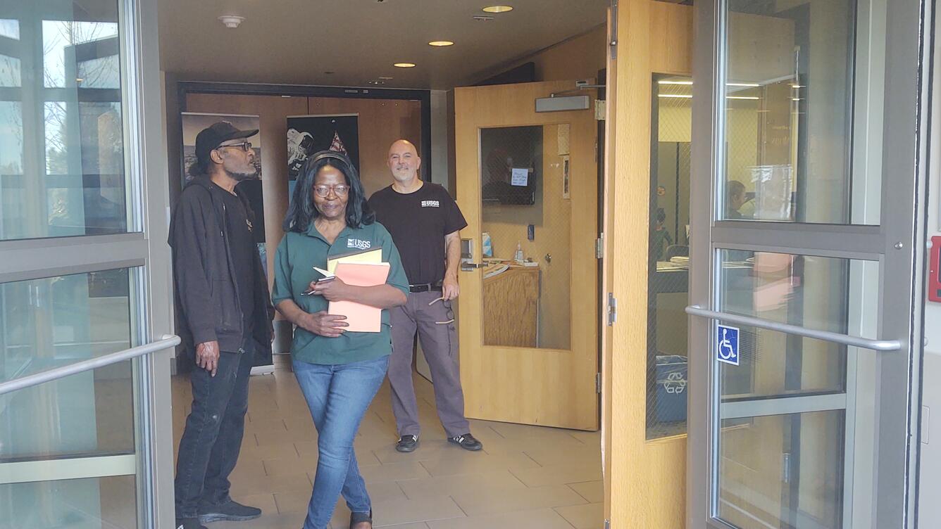 Janet Richie, Greg Vaughn and a visitor at the USGS Astrogeology Science Center in 2023