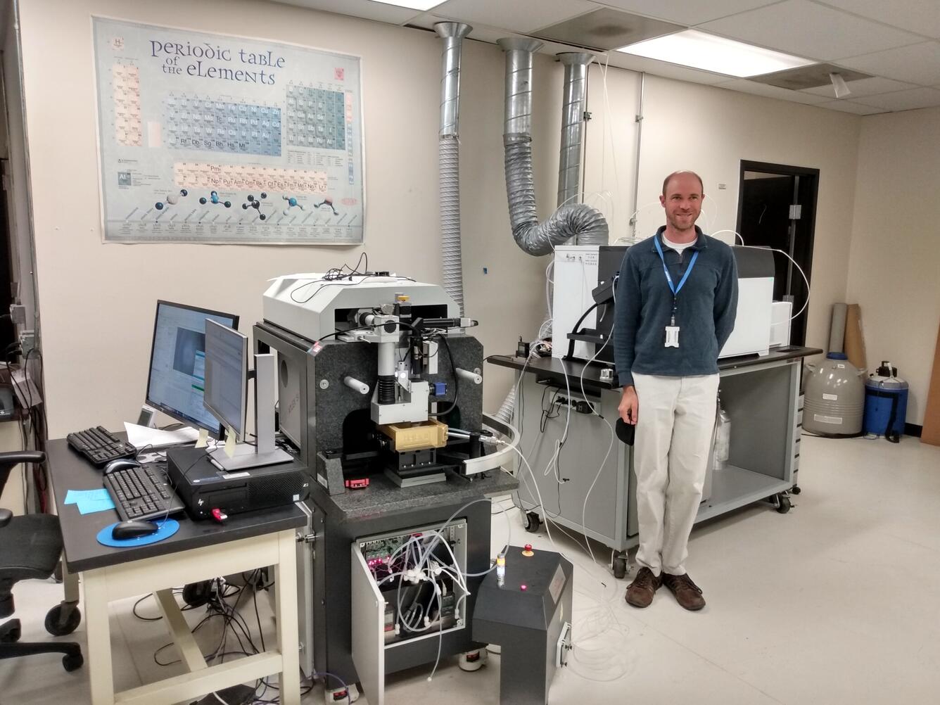 man standing in lab near equipment