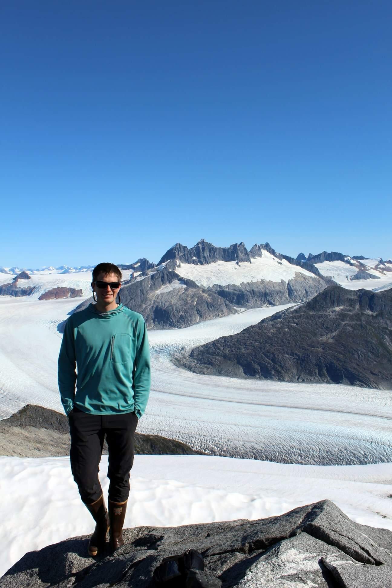 Jonathan Tuttle standing outside around snow.