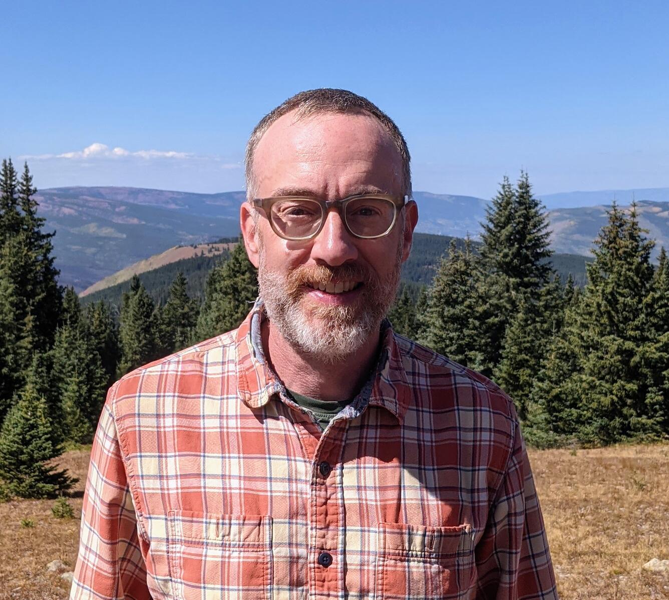 USGS Geologist Judd Goldberg portrait taken in the mountains