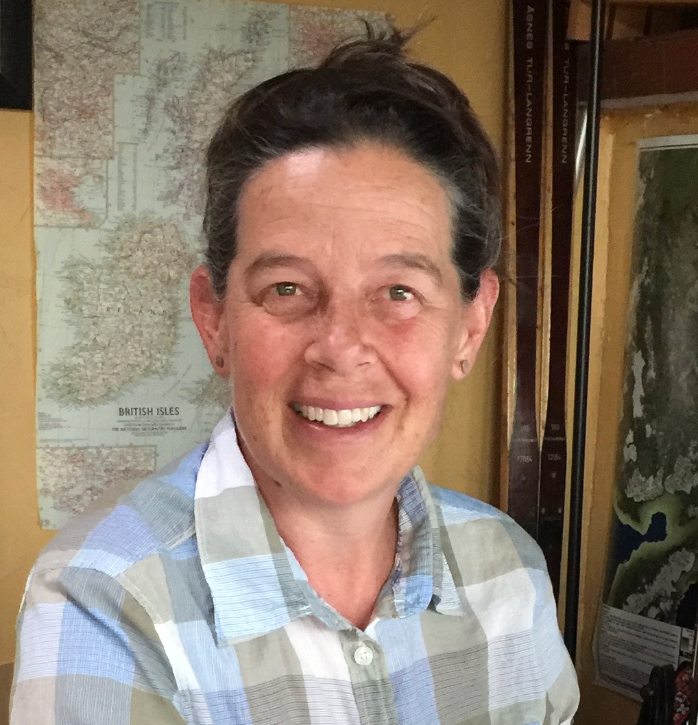 portrait of Lesleigh Anderson in front of map