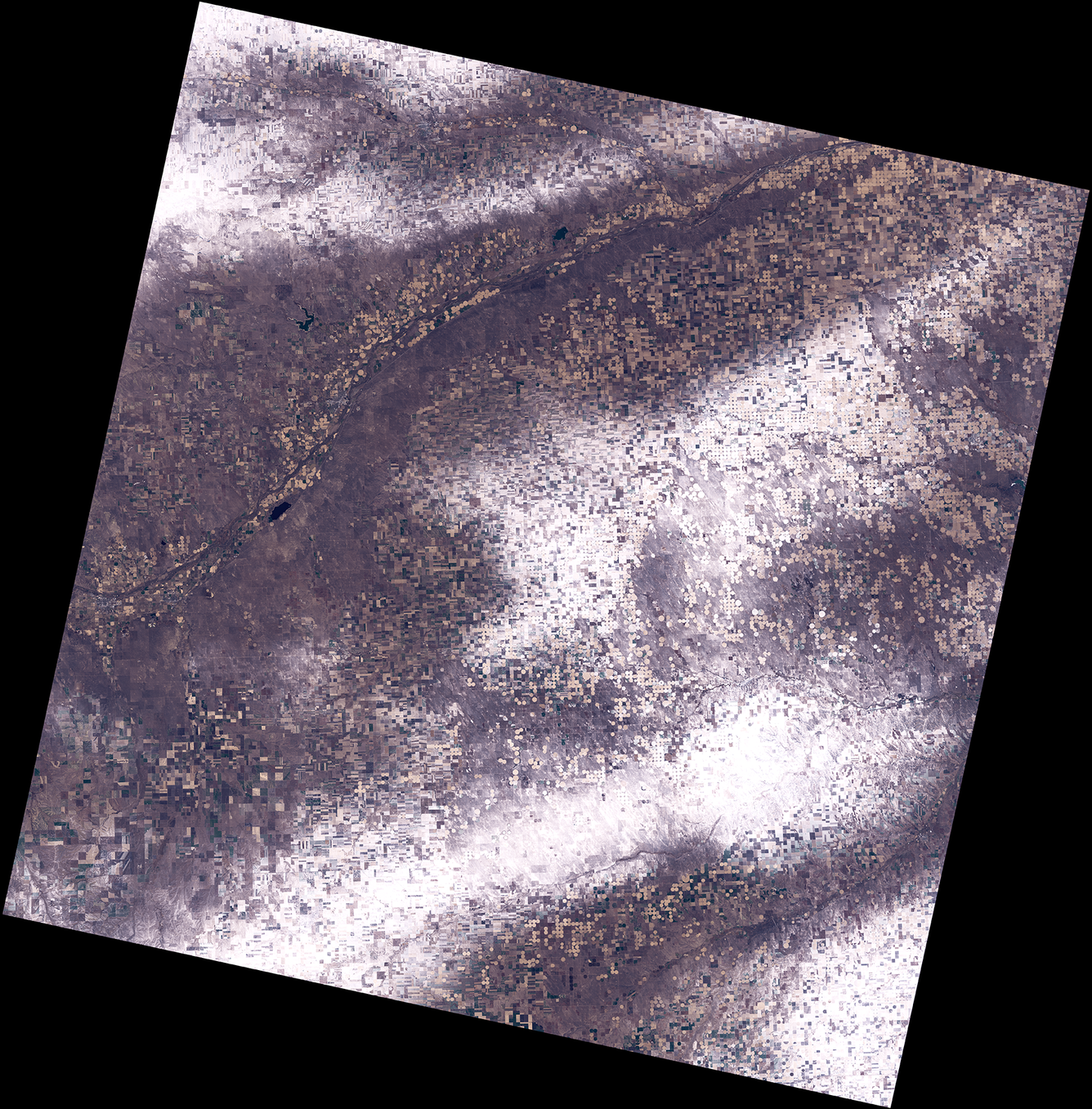 A Landsat satellite image showing bands of snow 