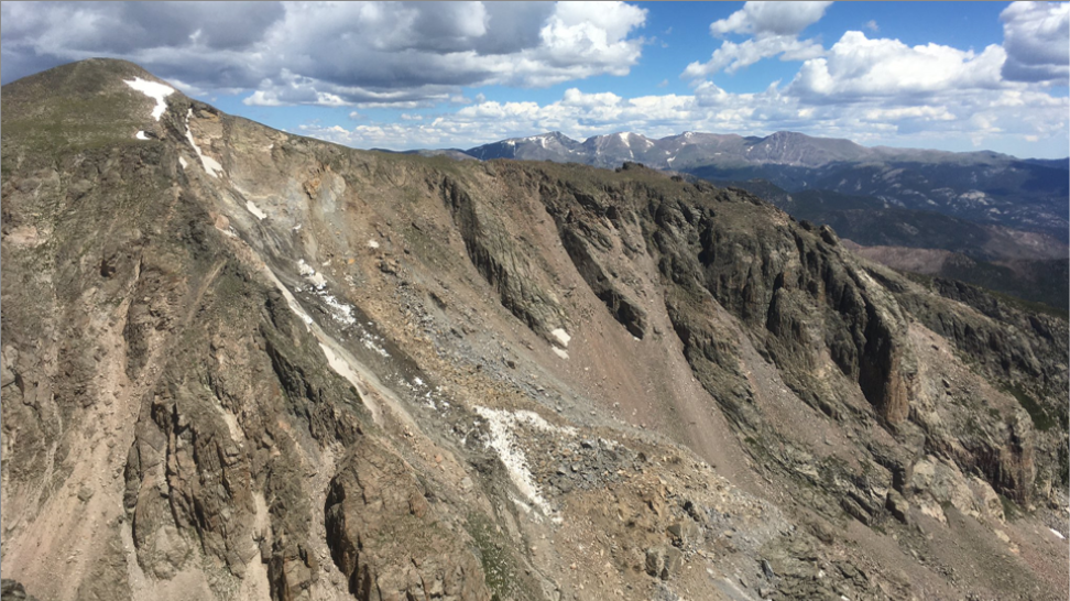 Mountains side covered with rock and snow