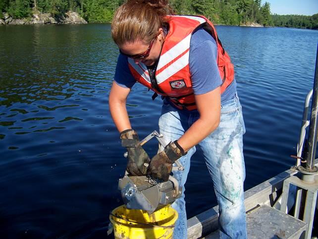 Graduate student working on a lake sturgeon project