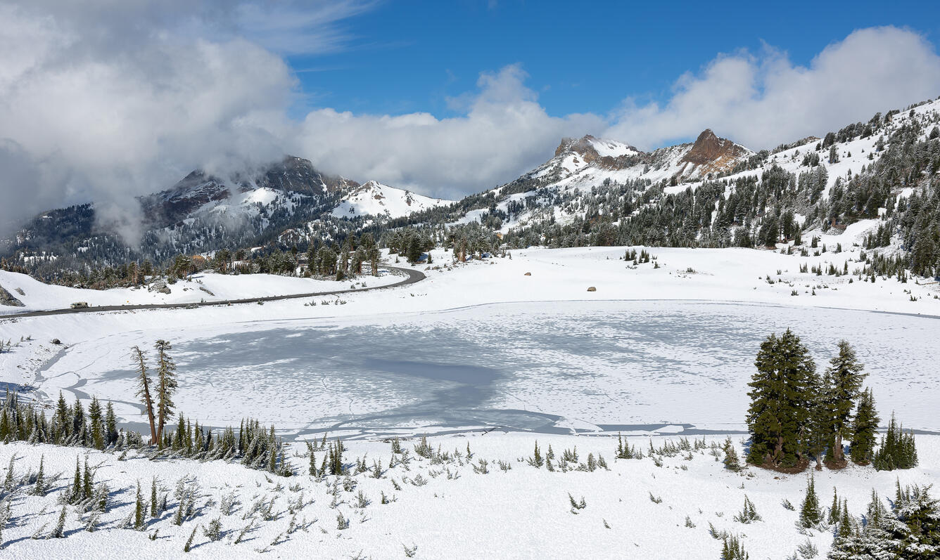 Snow on mountain with clouds in background