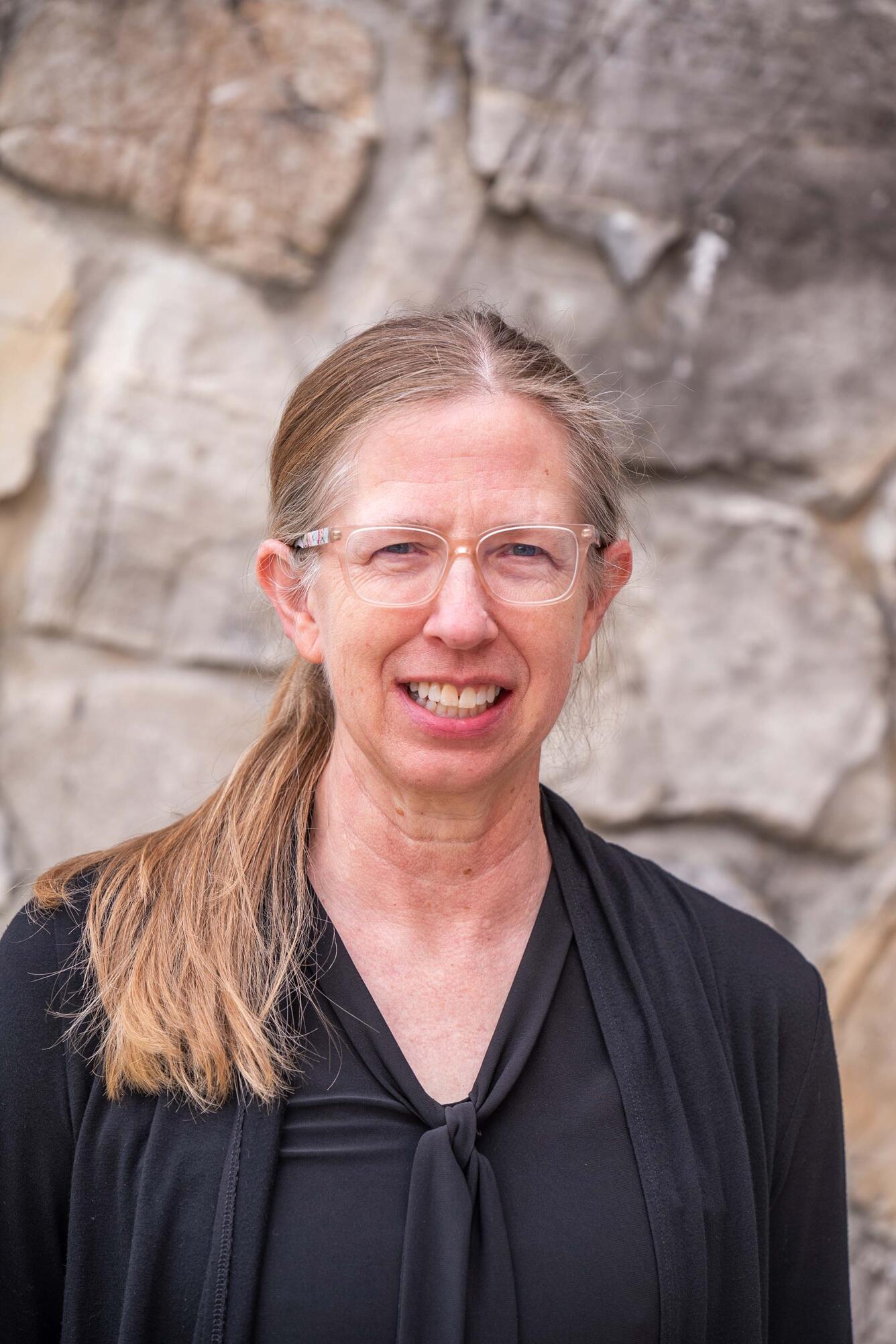 Headshot of Barb Lubinski with glasses and ponytail