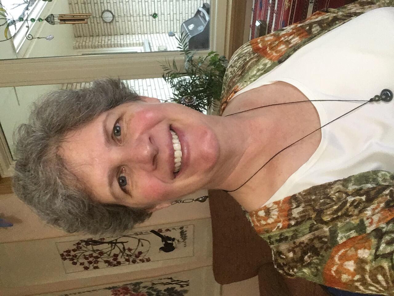 Woman taking self  photo at home