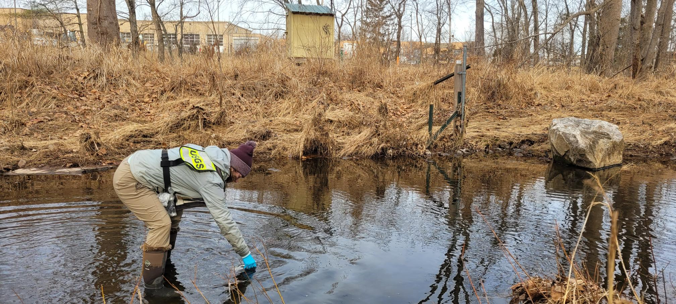 USGS scientist takes water sample from Fairfax County Stream