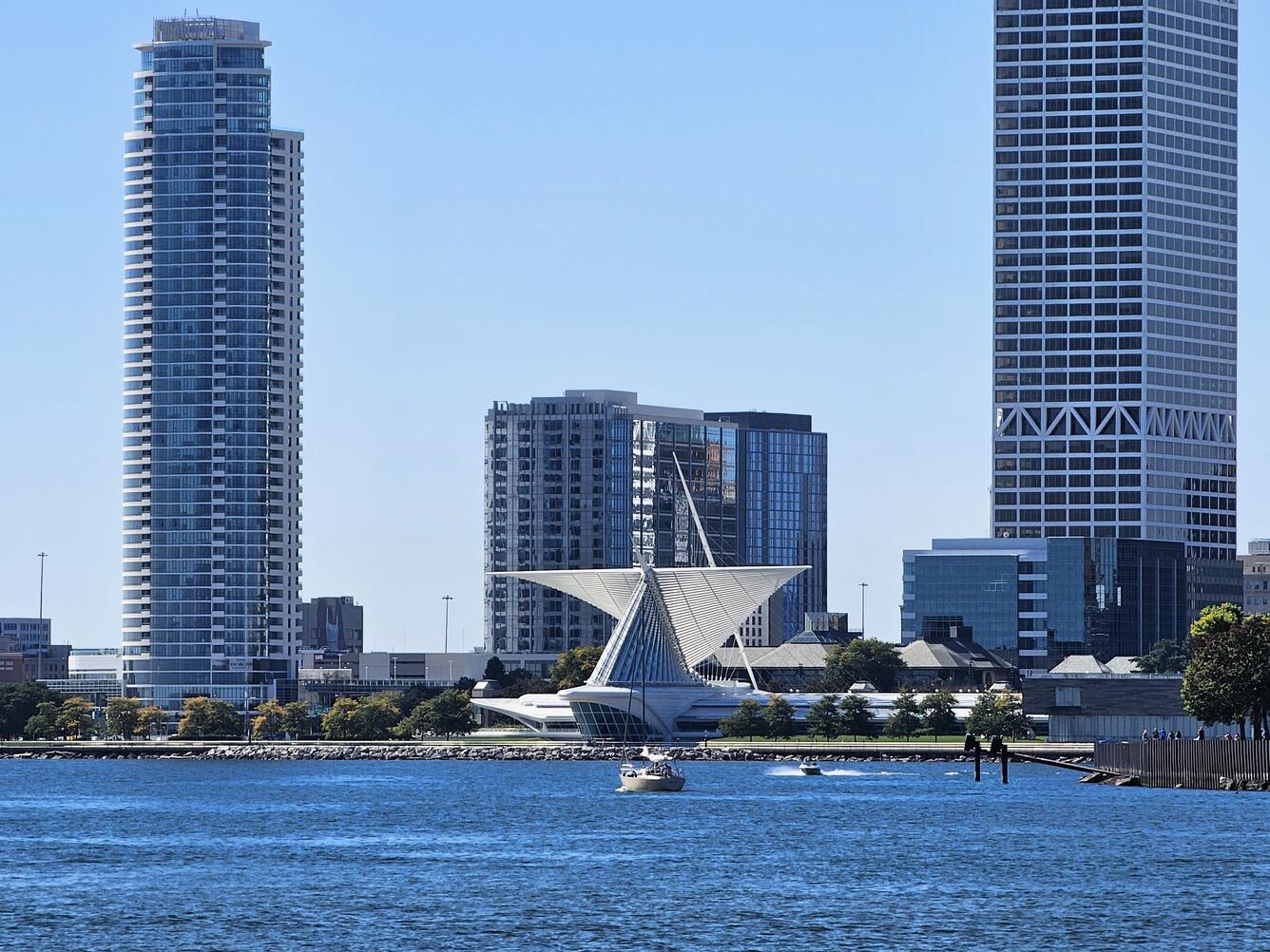 Milwaukee Harbor in foreground with Discovery World building and other tall buildings in background