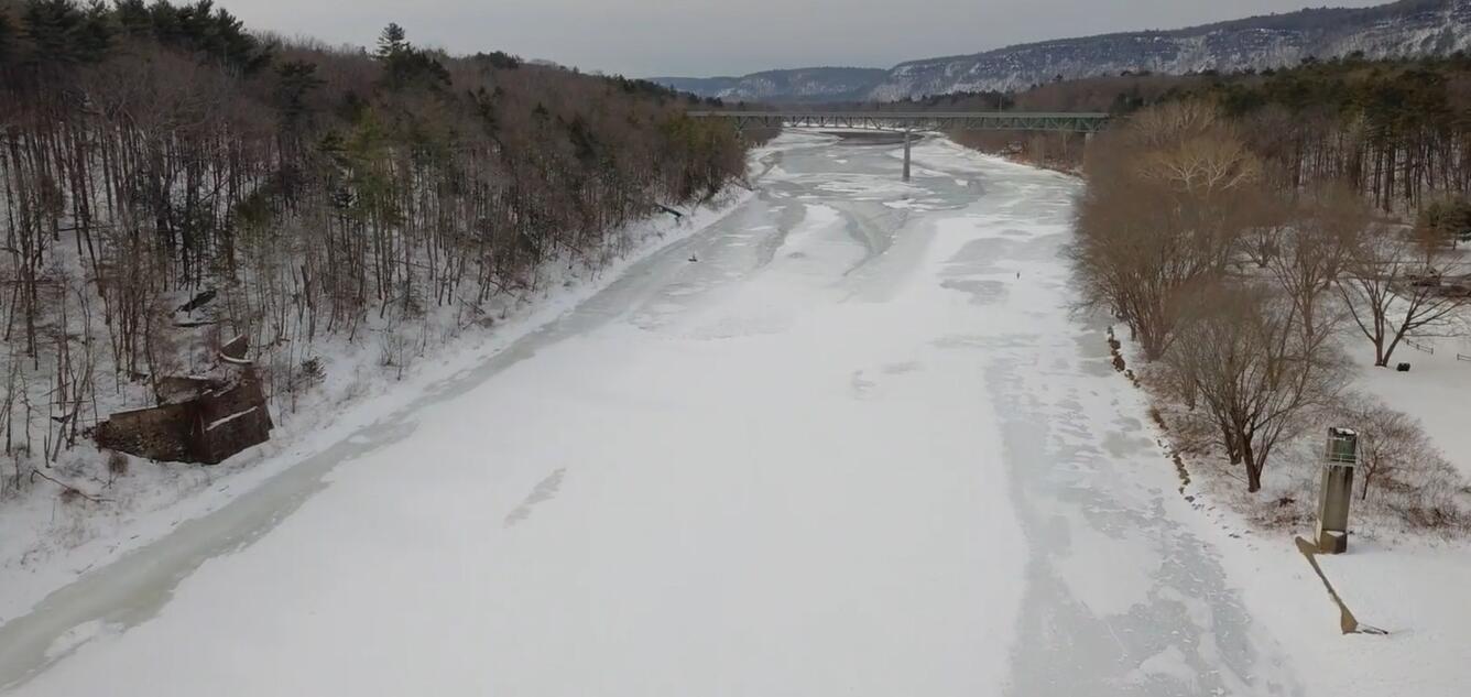 looking out over the frozen Delaware River from an aerial vantage