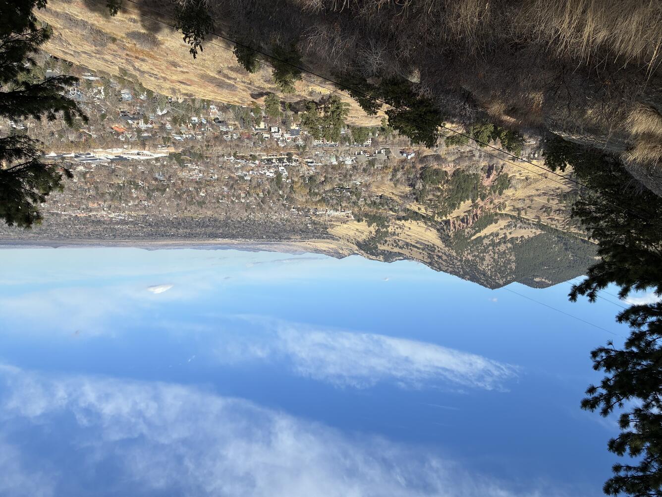 A mountain landscape with blue sky and white clouds
