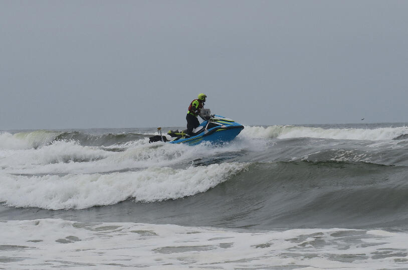 Kai Parker, USGS Oceanographer, navigates the surf zone on a personal watercraft during a bathymetric survey
