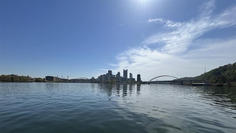 Pittsburgh Skyline during big river sampling (ALCOSAN), with blue skies and buildings in center of image. 