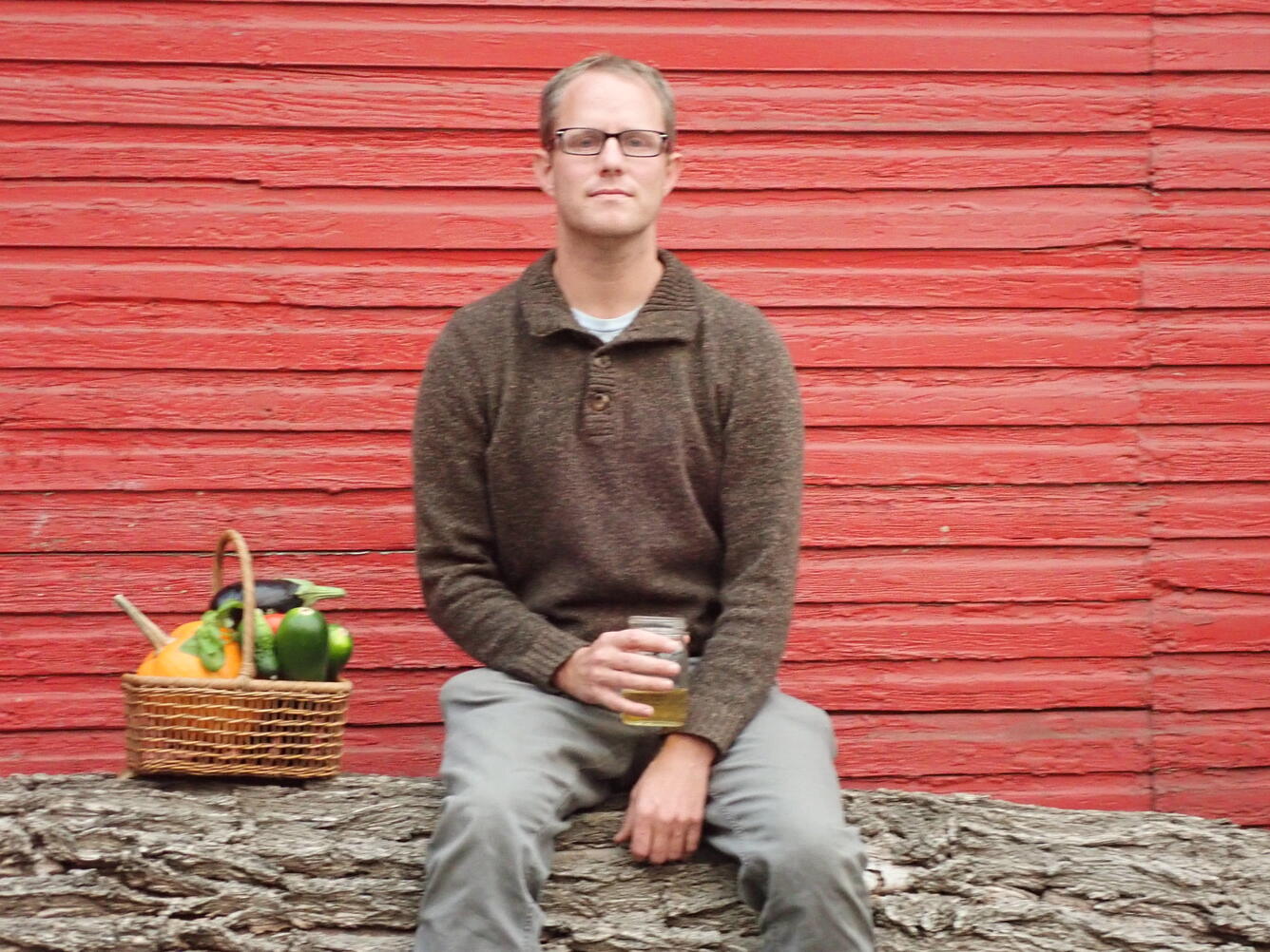 photo of a man in front of a red wall
