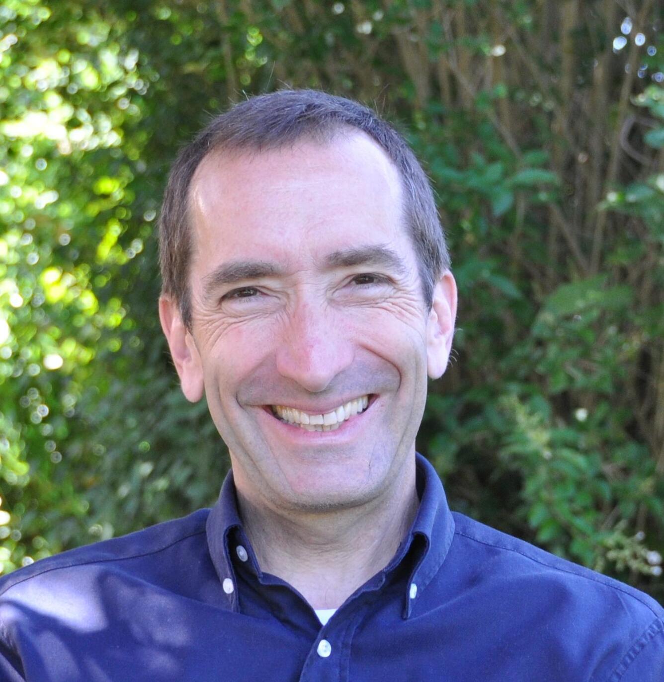 A portrait photograph of Philippe Hensel