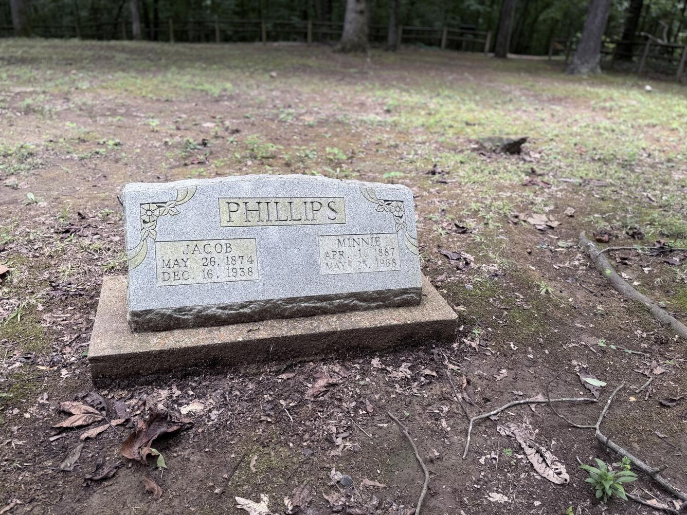 Phillips family headstone for Jacob and Minnie in a forest cemetery