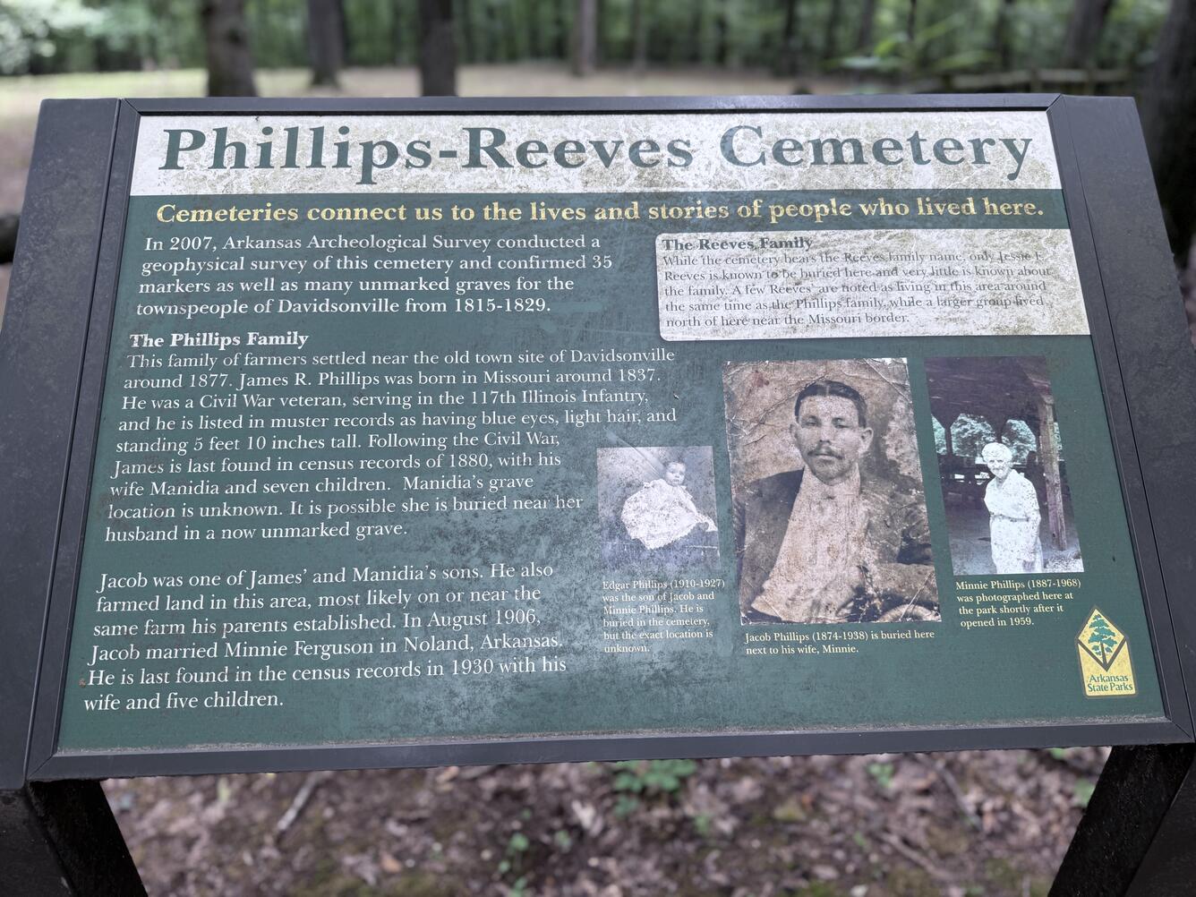Informational sign about the Phillips‑Reeves Cemetery with text and historic photos.