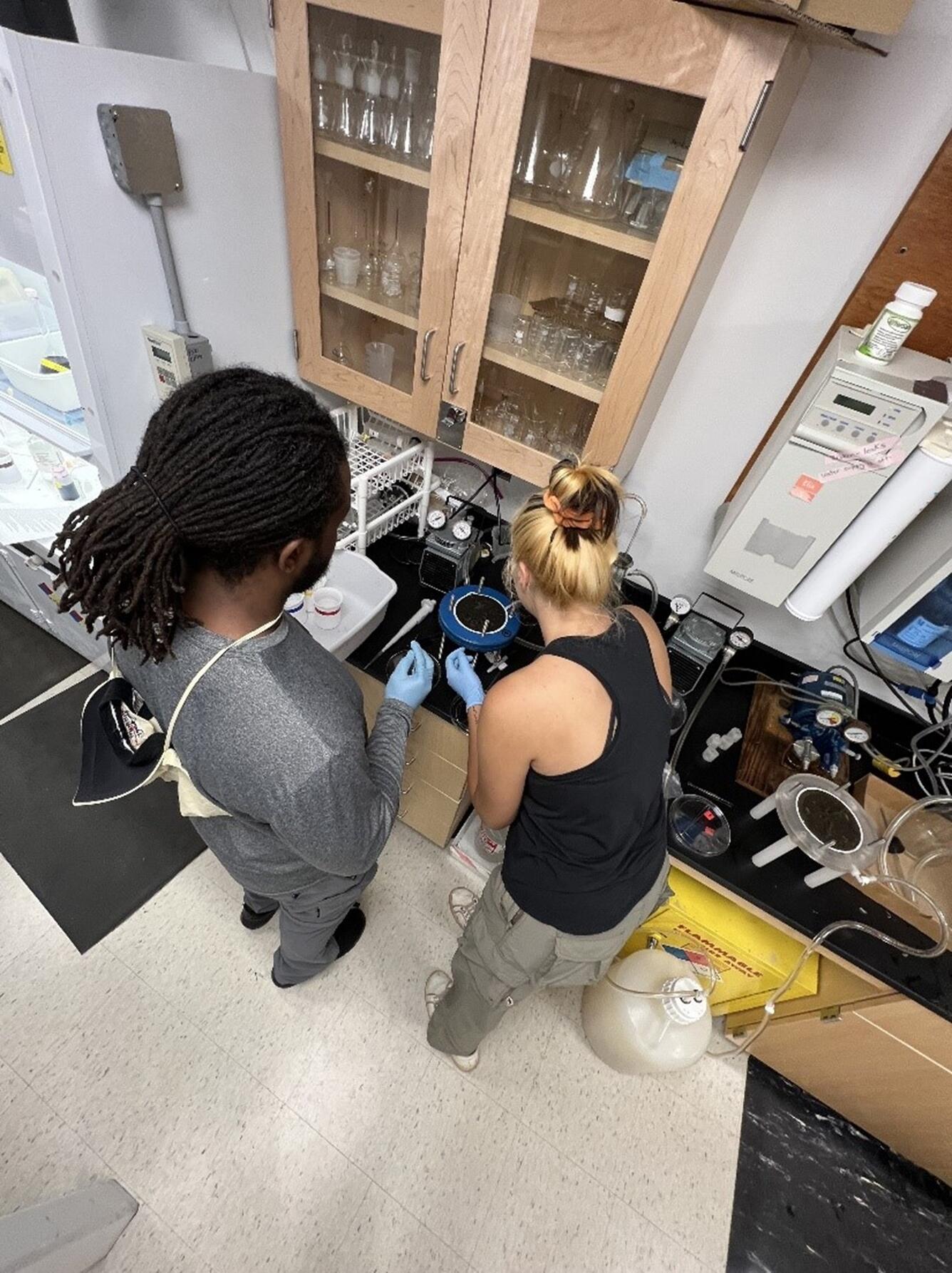 Aerial view of two people working in a lab