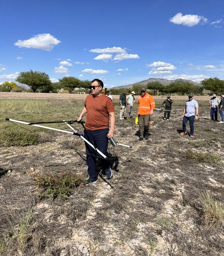 USGS hydrologist leads a field demonstration of a new subsurface geophysics tool