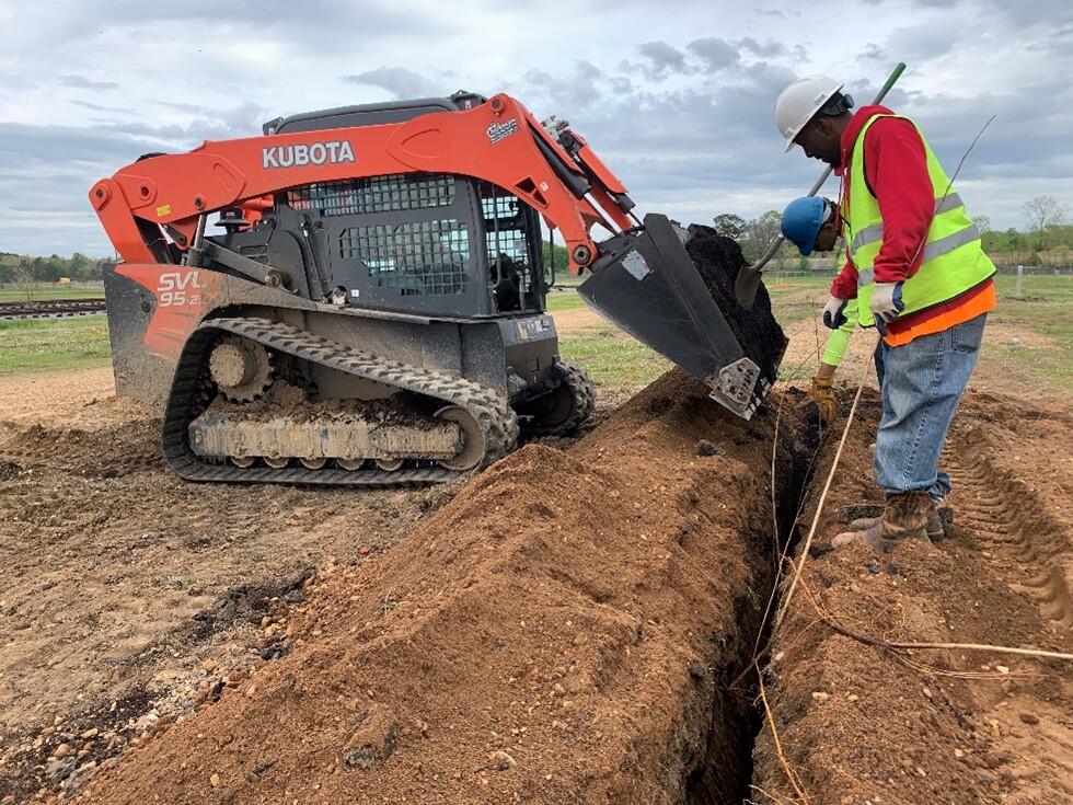 Installation of dormant hybrid poplar cuttings into a trench that was backfilled with clean topsoil, OU-3.